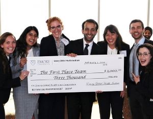 People holding a giant donation check